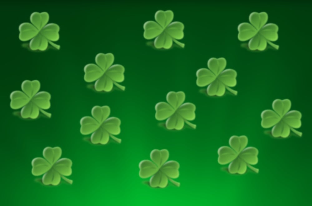 Shamrocks on a green glowing background.jpg