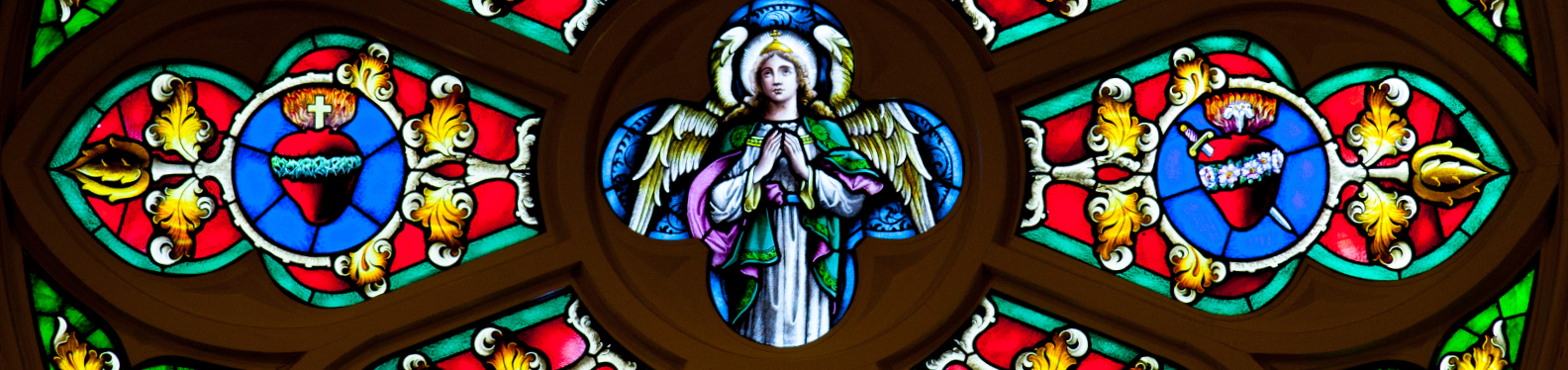 Rose Window featuring a detail of St. Michael and the Sacred Heart